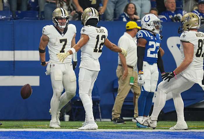 New Orleans Saints quarterback Taysom Hill (7) ad New Orleans Saints wide receiver Chris Olave (12) celebrate a touchdown by Hill on Sunday, Oct. 29, 2023, at Lucas Oil Stadium in Indianapolis.